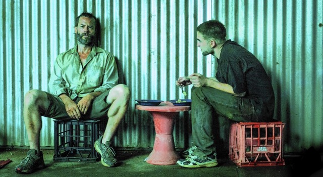 The Rover (2014) features a coolly desaturated palette of arid browns, sickly sodium-light greens and blanched flesh tones. 